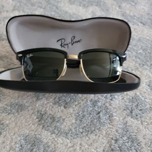 Womans black and gold Ray Bans